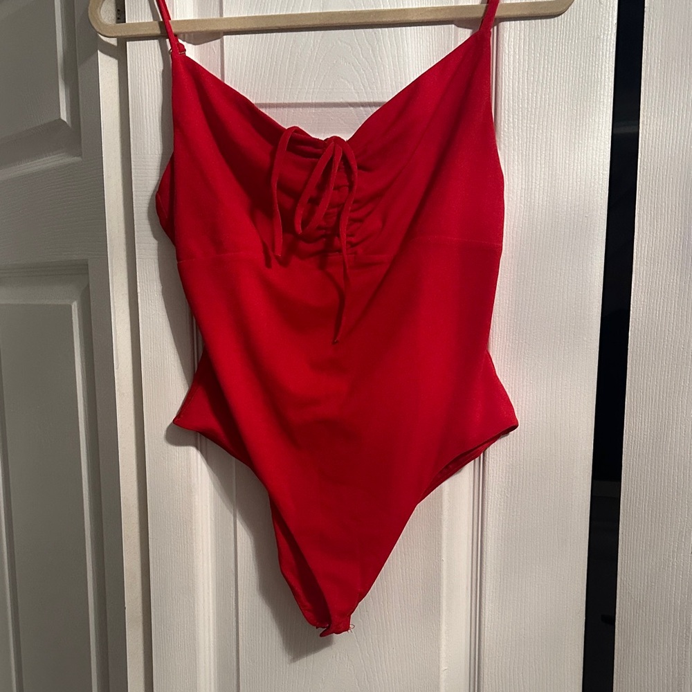 Red Ruched One-Piece bodysuit from 
TIGER MIST BRAND